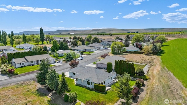 aerial view featuring a mountain view and a residential view