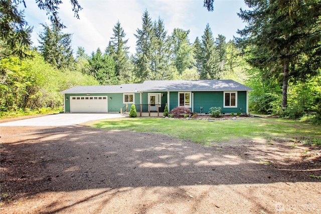 single story home featuring concrete driveway, a garage, a front lawn, and covered porch