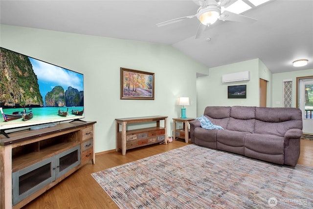 living room featuring a wall mounted air conditioner, light wood-style flooring, a ceiling fan, and vaulted ceiling