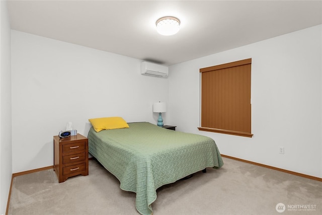 bedroom featuring a wall unit AC, carpet, and baseboards
