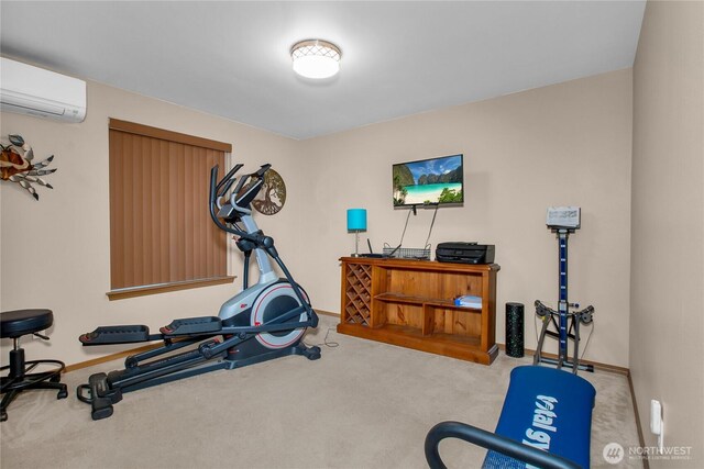 exercise area with a wall mounted AC, carpet, and baseboards