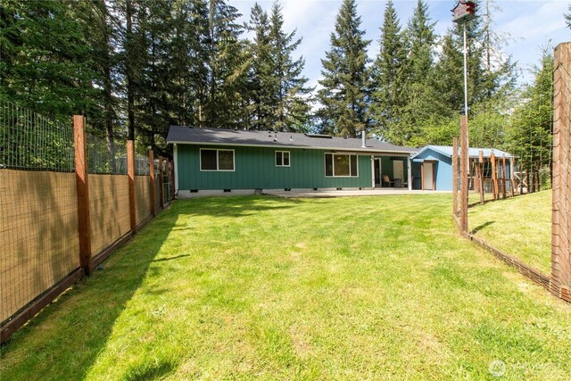 rear view of house featuring crawl space