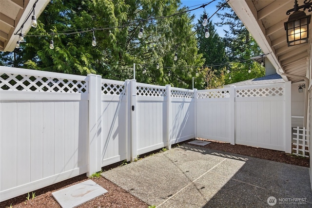 view of patio / terrace with fence and a gate