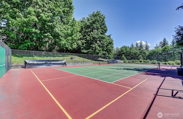 view of sport court featuring fence and community basketball court