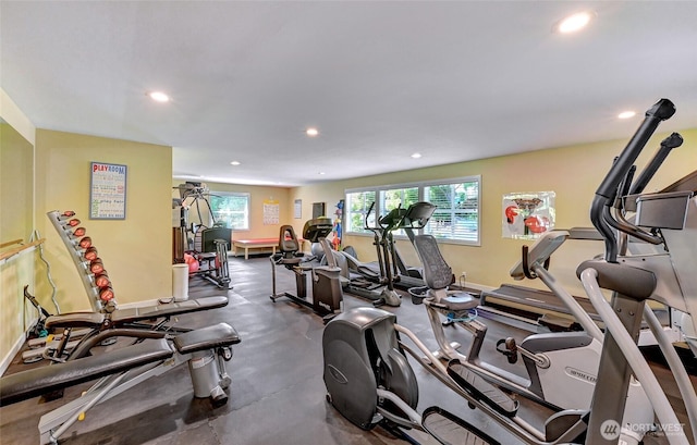 exercise room with baseboards and recessed lighting