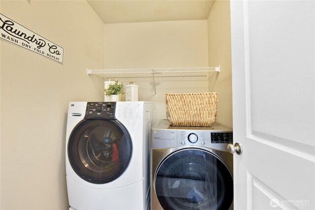 laundry room featuring washer and clothes dryer
