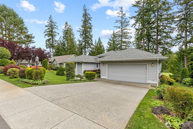 single story home with driveway, a garage, and a front yard