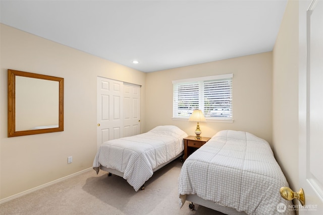 carpeted bedroom featuring a closet, baseboards, and recessed lighting