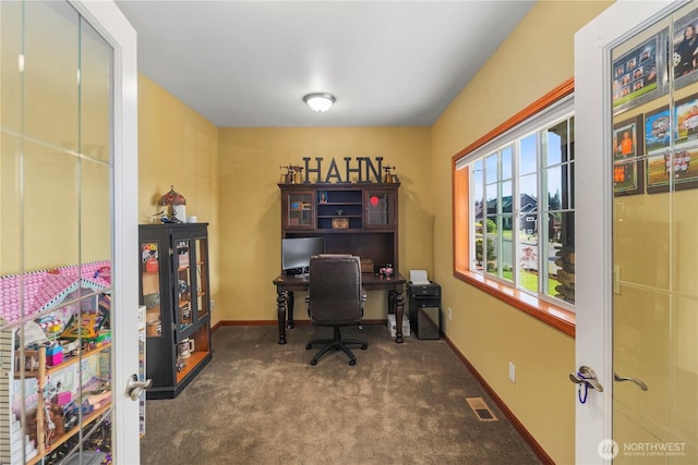 office area featuring carpet flooring and baseboards