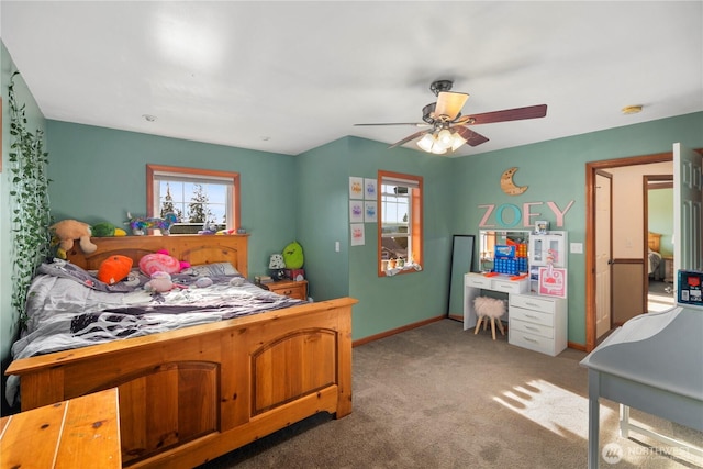 carpeted bedroom with baseboards and a ceiling fan