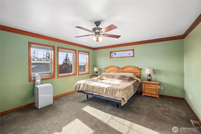 bedroom featuring baseboards, ornamental molding, carpet floors, and ceiling fan