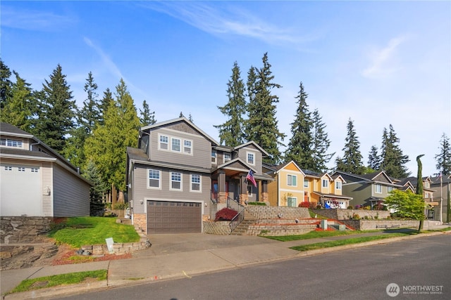 craftsman-style home featuring a residential view, driveway, and an attached garage