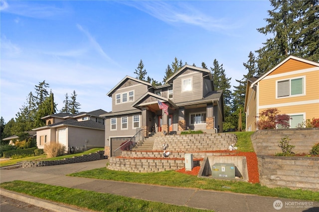 craftsman inspired home with concrete driveway, an attached garage, stone siding, and a porch