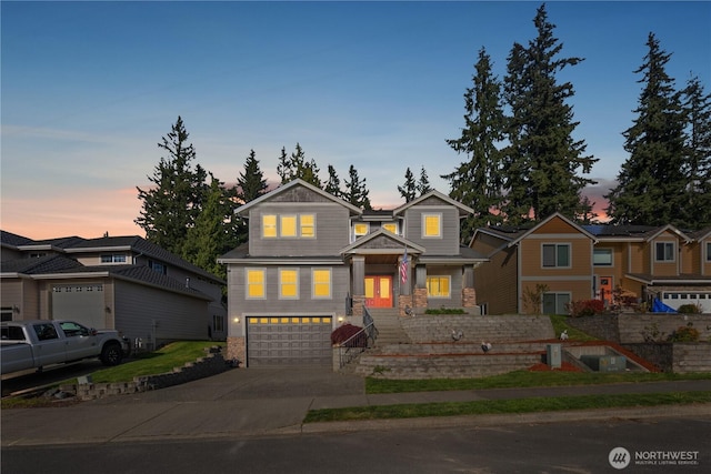 view of front of home with driveway and a garage