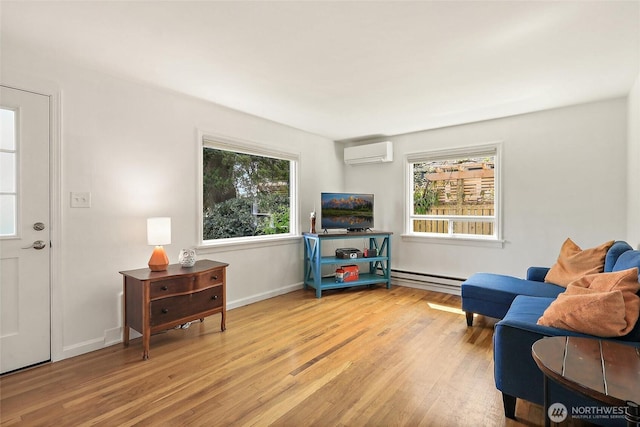 living room featuring baseboards, wood finished floors, baseboard heating, and an AC wall unit