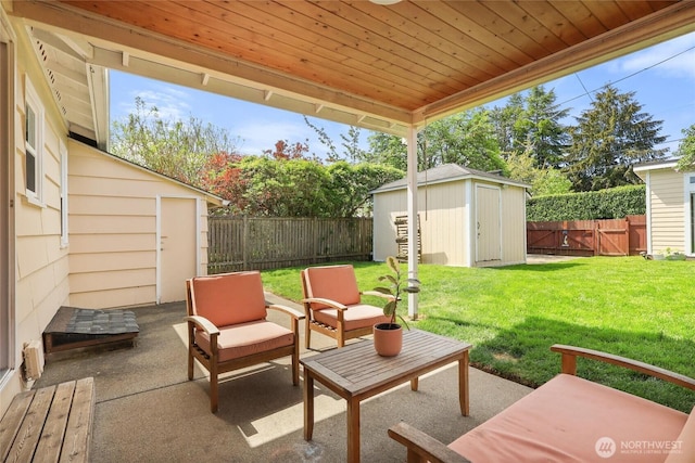 view of patio featuring a fenced backyard, an outbuilding, and a storage shed