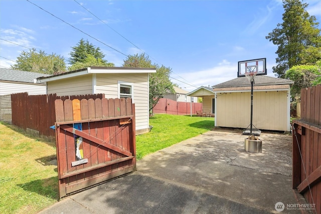 view of patio with an outbuilding and fence