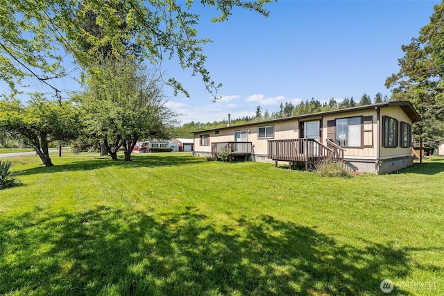 view of yard with a wooden deck