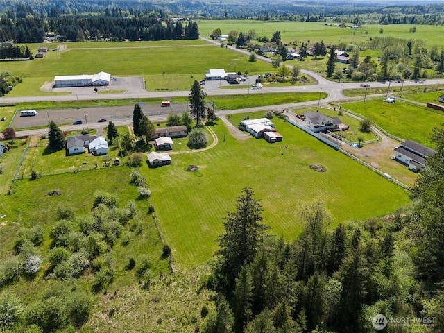 birds eye view of property featuring a rural view