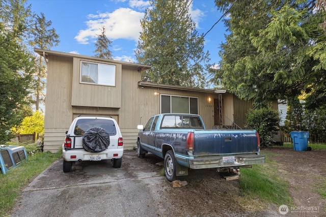 split level home featuring driveway