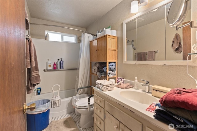 full bathroom featuring toilet, a textured wall, tile patterned floors, shower / tub combo, and vanity
