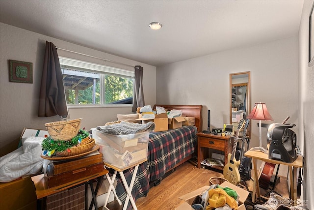 bedroom featuring wood finished floors