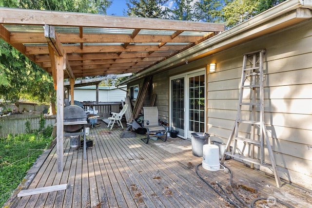 wooden terrace with fence and area for grilling