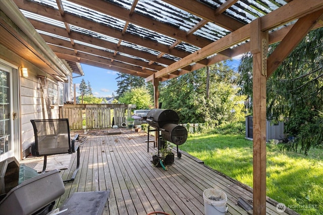 wooden deck with a pergola, a yard, a storage shed, an outbuilding, and a grill