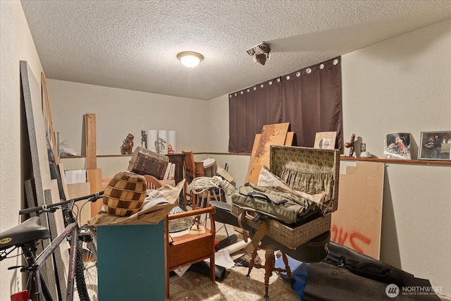miscellaneous room featuring a textured ceiling