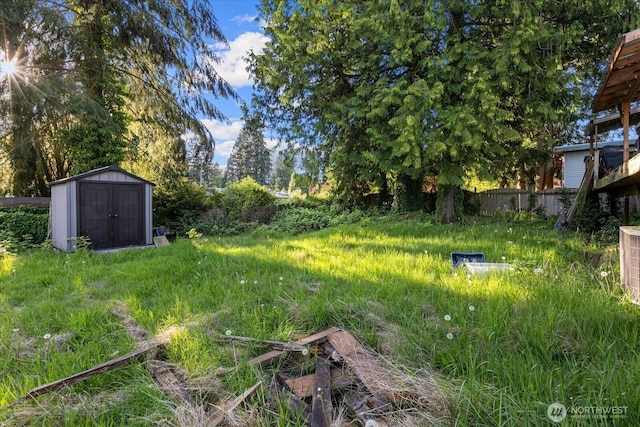 view of yard with a shed and an outbuilding