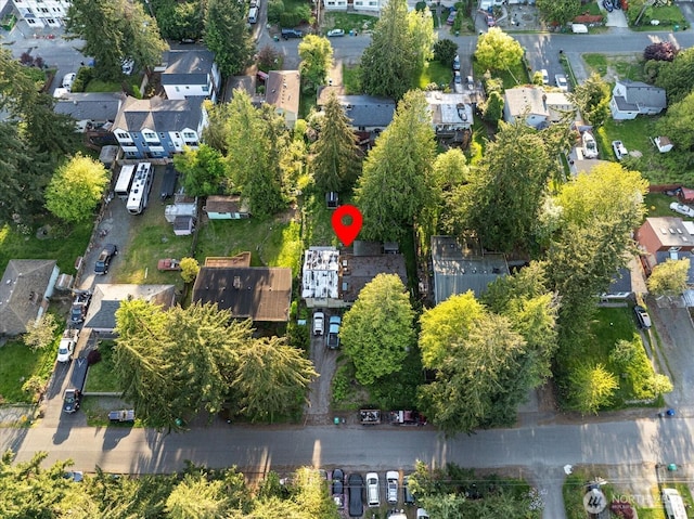 aerial view of property's location with nearby suburban area