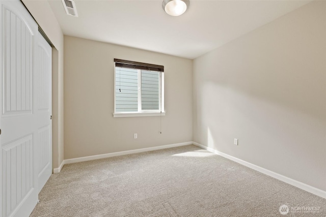 1517 Onyx St SE, Olympia, WA 98501 - unfurnished bedroom featuring carpet flooring, a closet, visible vents, and baseboards