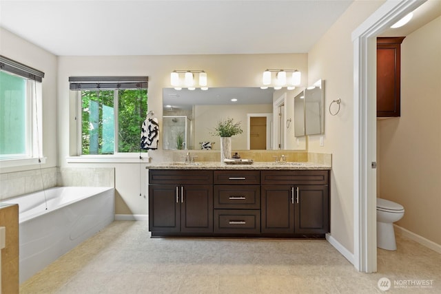 1517 Onyx St SE, Olympia, WA 98501 - full bathroom featuring toilet, baseboards, a stall shower, and a sink