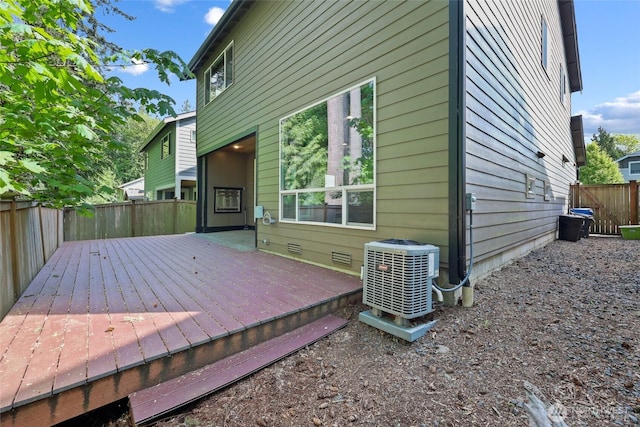 1517 Onyx St SE, Olympia, WA 98501 - exterior space featuring central air condition unit, crawl space, a deck, and a fenced backyard