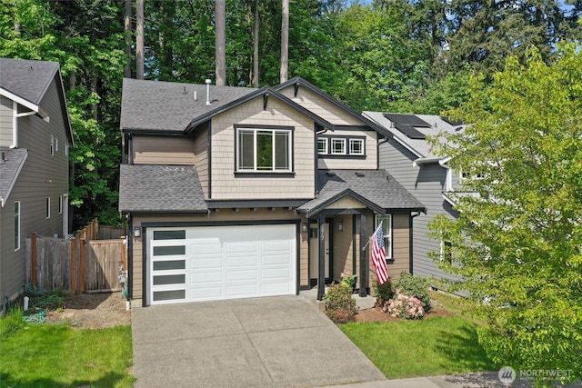 1517 Onyx St SE, Olympia, WA 98501 - view of front of property with concrete driveway, a shingled roof, fence, and an attached garage