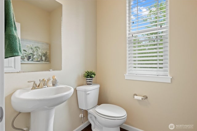 1517 Onyx St SE, Olympia, WA 98501 - half bath with toilet, baseboards, and a healthy amount of sunlight