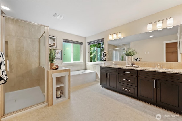 1517 Onyx St SE, Olympia, WA 98501 - bathroom featuring double vanity, a garden tub, a shower stall, and a sink