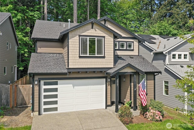 1517 Onyx St SE, Olympia, WA 98501 - view of front facade featuring roof with shingles, fence, a garage, and driveway