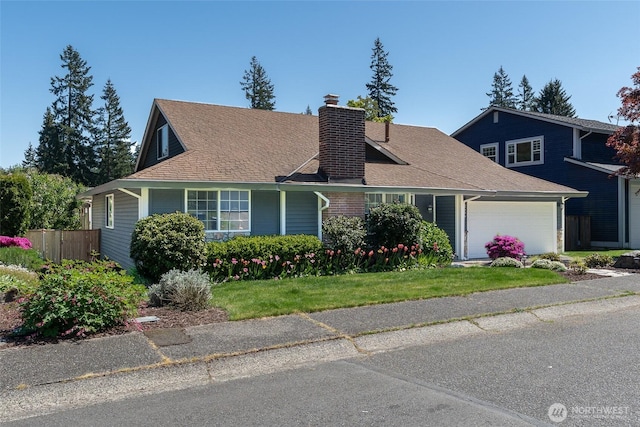 2656 168th Ave NE, Bellevue, WA 98008 - view of front of home with a chimney, an attached garage, and fence