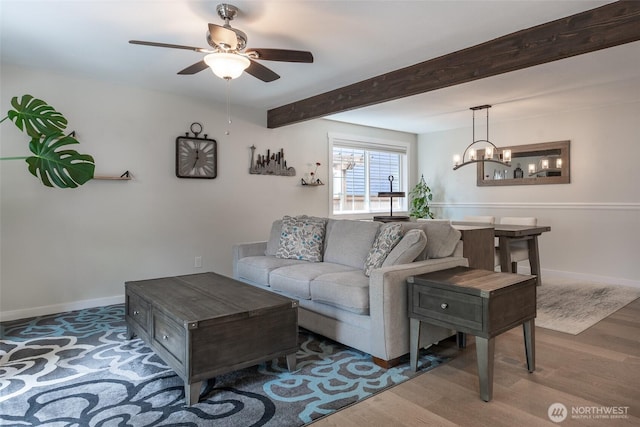 2656 168th Ave NE, Bellevue, WA 98008 - living room featuring wood finished floors, a ceiling fan, beamed ceiling, baseboards, and a chandelier