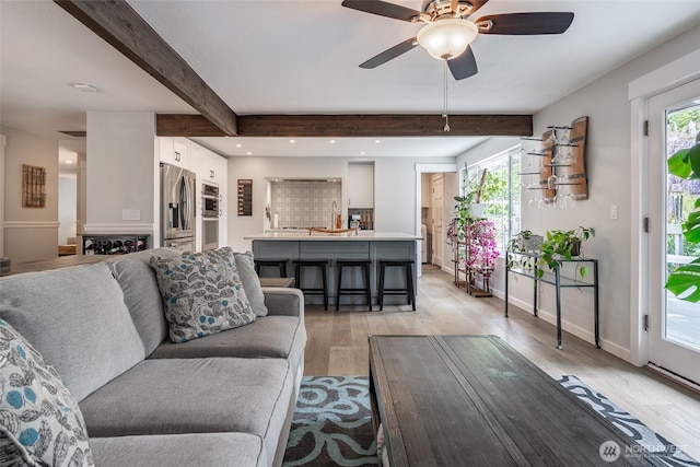 2656 168th Ave NE, Bellevue, WA 98008 - living area featuring light wood-style flooring, beam ceiling, ceiling fan, baseboards, and recessed lighting
