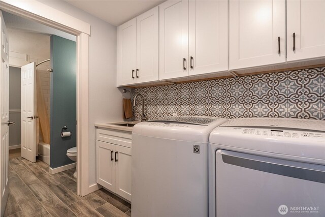 2656 168th Ave NE, Bellevue, WA 98008 - clothes washing area with a sink, independent washer and dryer, wood finished floors, and baseboards