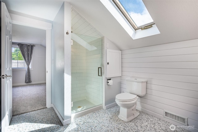 2656 168th Ave NE, Bellevue, WA 98008 - bathroom featuring lofted ceiling, a skylight, a stall shower, toilet, and baseboards