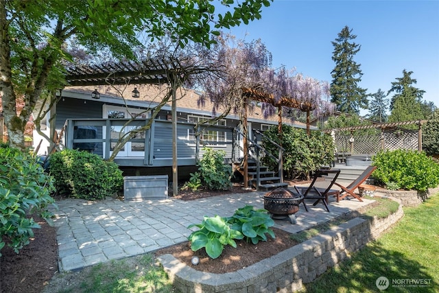 2656 168th Ave NE, Bellevue, WA 98008 - rear view of property featuring a fire pit, a patio area, and a deck
