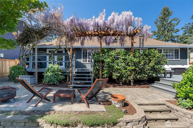2656 168th Ave NE, Bellevue, WA 98008 - back of property with a fire pit, a patio, and a deck
