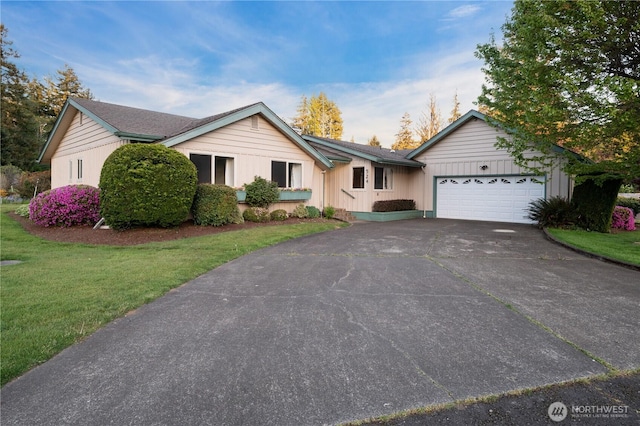 524 Carl Way, Aberdeen, WA 98520 - ranch-style home featuring an attached garage, concrete driveway, a front yard, and board and batten siding