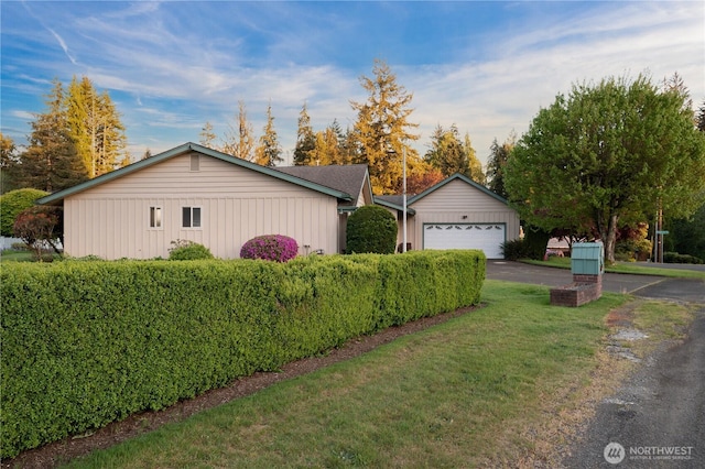 524 Carl Way, Aberdeen, WA 98520 - view of home's exterior with a garage, a yard, and board and batten siding