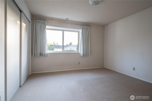 524 Carl Way, Aberdeen, WA 98520 - unfurnished room featuring carpet floors, a textured ceiling, and baseboards