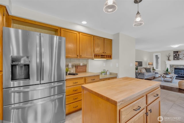 15525 66th Ave SE, Snohomish, WA 98296 - kitchen with stainless steel refrigerator with ice dispenser, wooden counters, light tile patterned flooring, and open floor plan