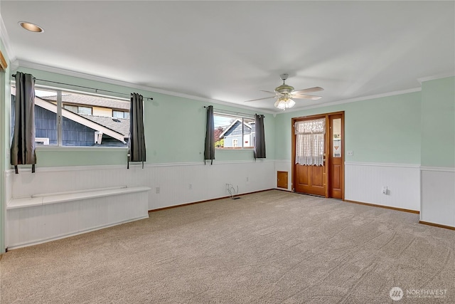 7351 32nd Ave SW, Seattle, WA 98126 - carpeted spare room featuring a wainscoted wall, a ceiling fan, and crown molding